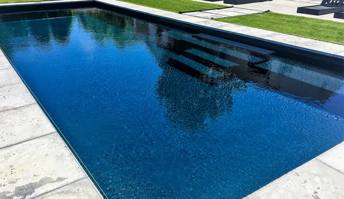 The Grand rectangular fiberglass pool with great side entry steps from Leisure Pools Beaufort