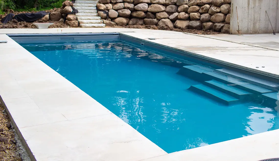 Leisure Pools The Grand rectangular fiberglass pool side view by Leisure Pools Beaufort